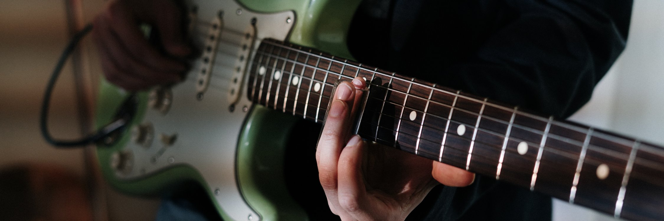 Acoustic electric guitars with built-in pickups for live performance and recording at Son of Drum Australia.